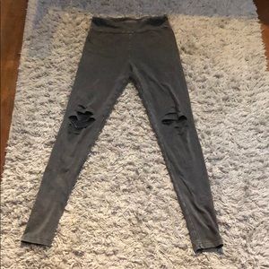 Grey leggings with slits in the knees